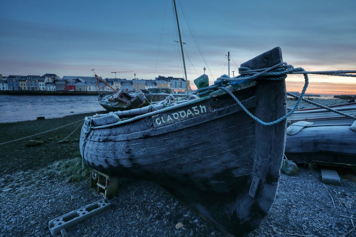 An image of a fishing boat with the Claddagh painted on as an encryption, a popular place to visit in Galway City